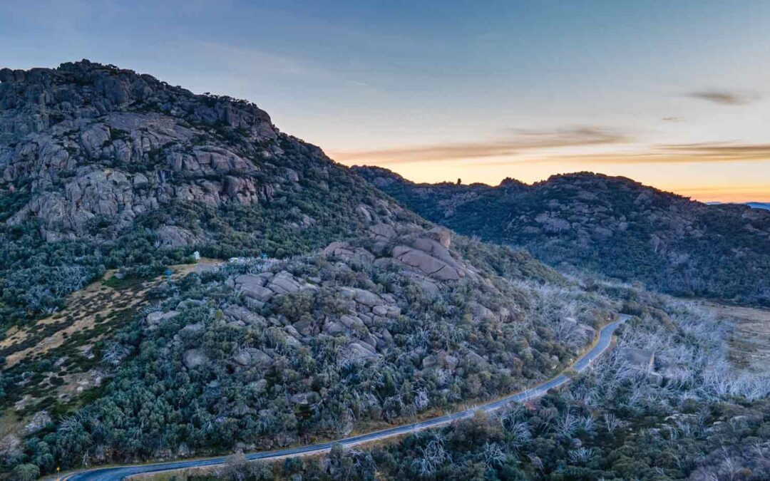 A photograph of The Grampians mountain road at sunset.